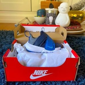 Brand new in box Nike Flex Advance in Midnight Navy Blue. Size 2 months.